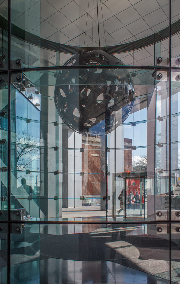 Circular glass-enclosed lobby.