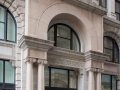 The original entryway was inscribed "The American Tract Society Building" and flanked by sculptures of angels.