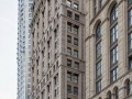 View down Spruce Street. New York by Gehry towers behind, the former New York Times Building stands in front of the American Tract Society Building.