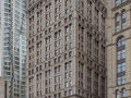 View down Spruce Street. New York by Gehry towers behind, the former New York Times Building stands in front of the American Tract Society Building.