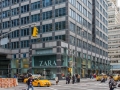 At street level the color scheme has warmed to blue-green puntuated by gray and near-black polished granite.
