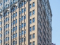 The building follows the base-shaft-capital scheme. Arches above the windows have very subtle gothic point.