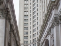 A four-story-high colonnade screens a courtyard along the front (NW) facade.