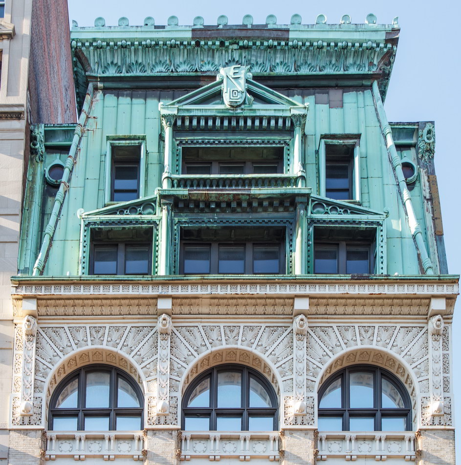 The massive copper mansard roof is easy to spot from a block away.