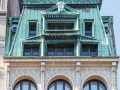 The massive copper mansard roof is easy to spot from a block away.