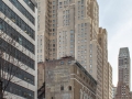 The four-story "NEW YORKER" sign is the building's most prominent feature.