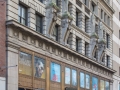 The bronze storefronts are a 1929 revision.