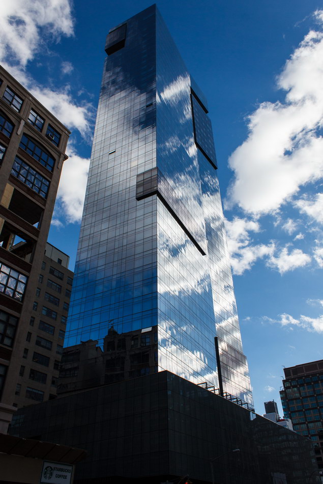 Interesting play of clouds and sky against the mirror facade.