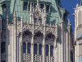 A closeup shows that much of the terra cotta is repaired, replaced or missing. The roof was originally gilded.